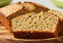 Slice of moist healthy zucchini bread on a plate