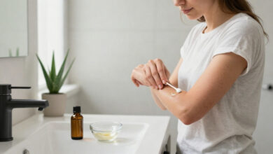 Tea tree on eczema shown through a woman patch testing diluted oil on her forearm.